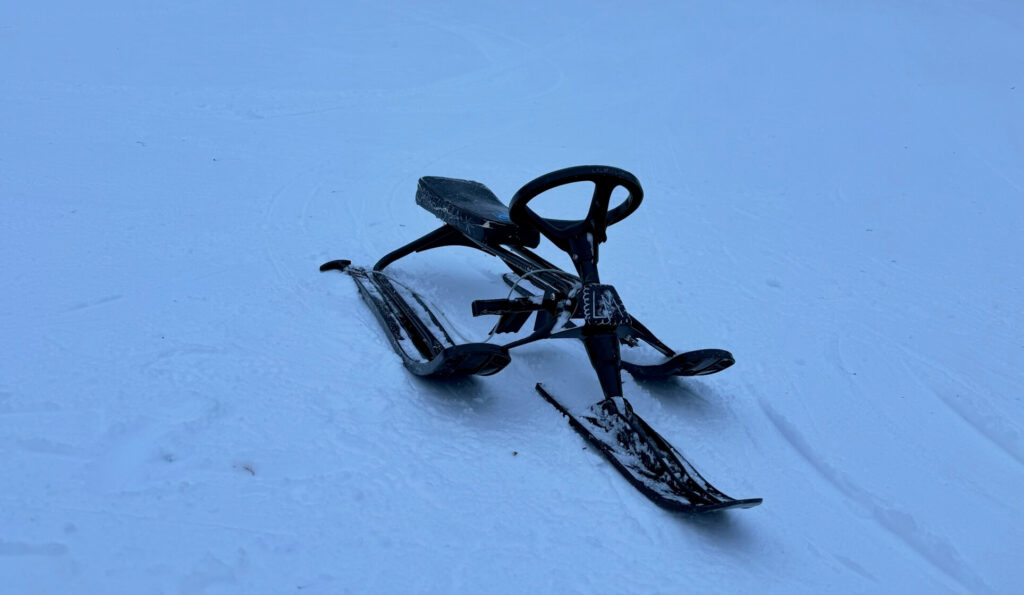 Sledge with a steering wheel on the snow in Levi