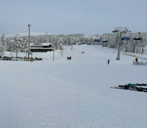 Early morning view of wide ski slope and chairlift at Levi’s South Slopes